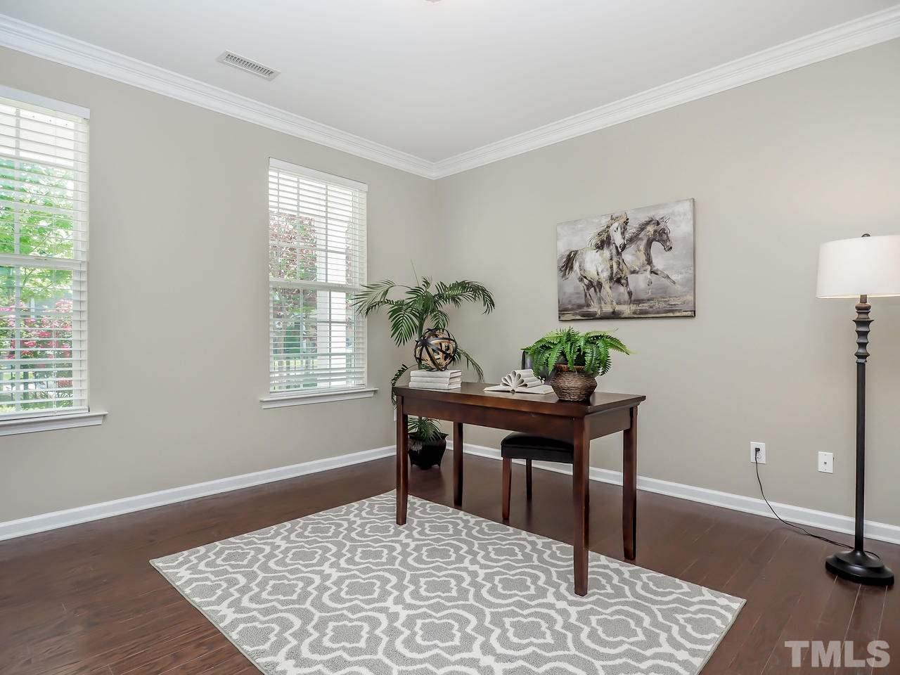 934 Ileagnes Road Raleigh, NC 27603 - Photo 5 of 23 a view of a workspace with furniture and window