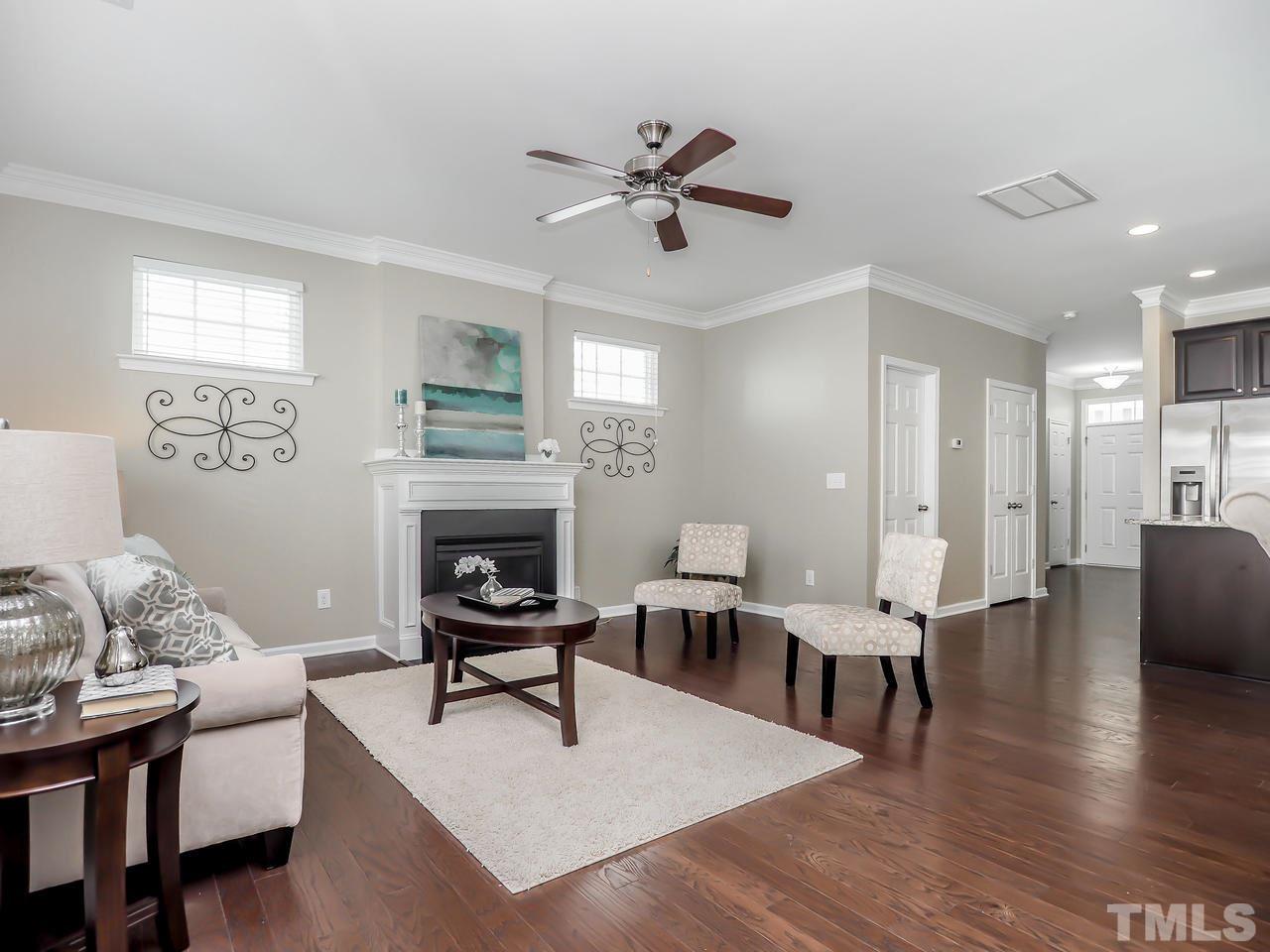 934 Ileagnes Road Raleigh, NC 27603 - Photo 8 of 23 a living room with furniture and a fireplace