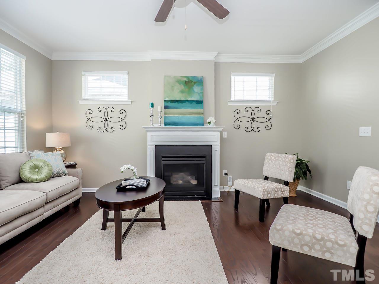 934 Ileagnes Road Raleigh, NC 27603 - Photo 10 of 23 a living room with furniture and a fireplace