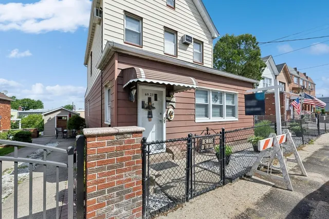 a view of house with outdoor seating space