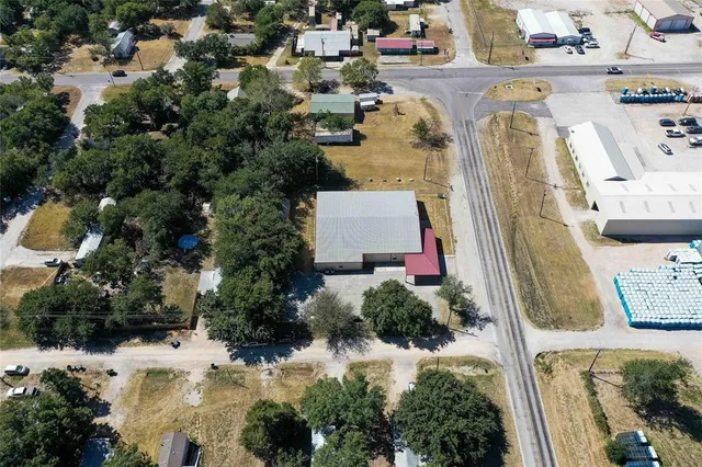 an aerial view of a house with a yard