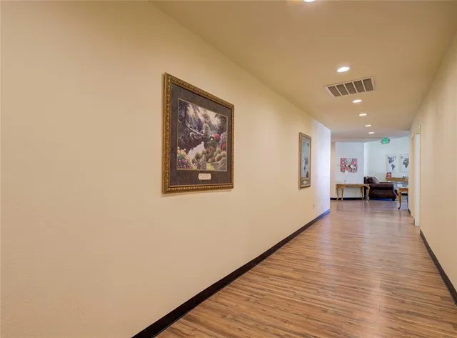 a view of a living room with wooden floor