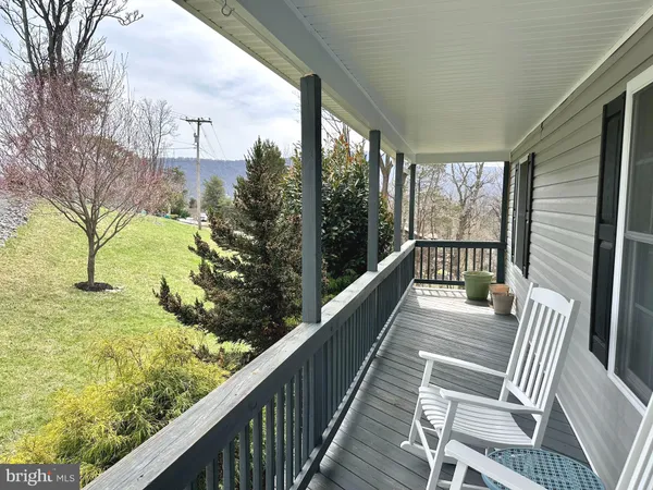 a view of balcony with furniture