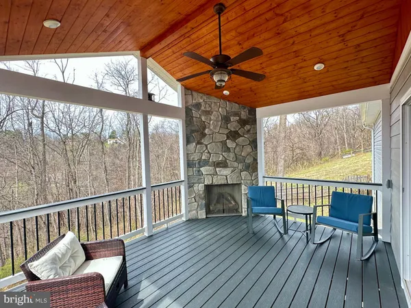 a view of a chairs on the roof deck