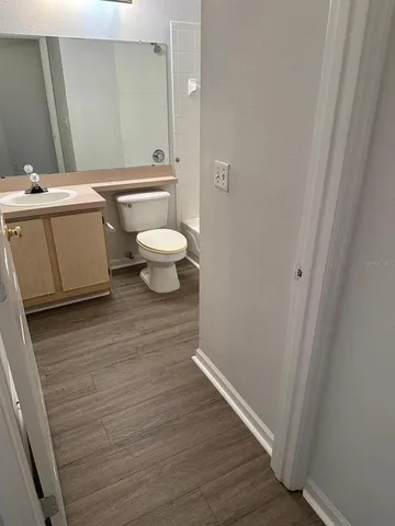 a bathroom with a toilet and bathtub