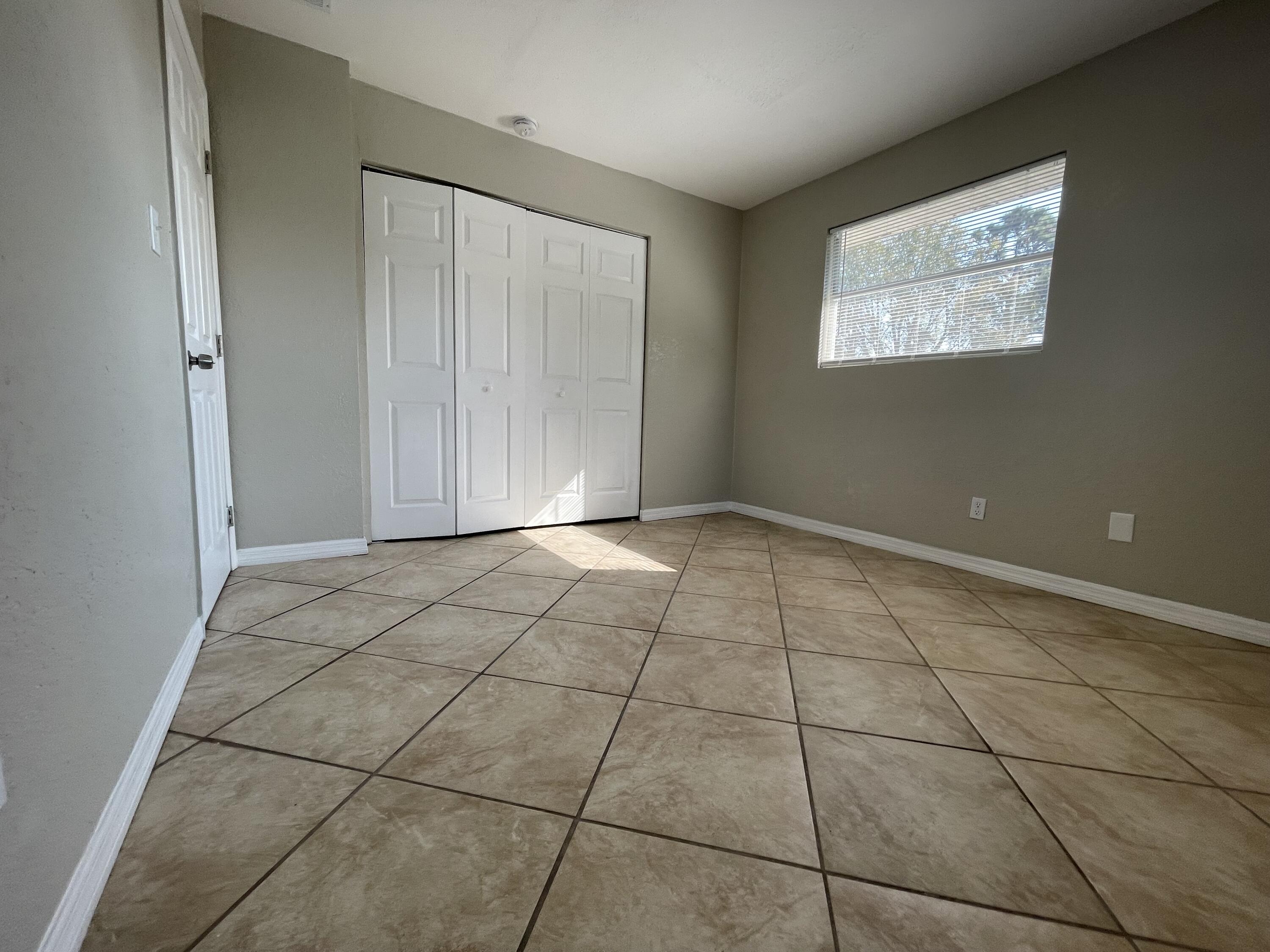 2880 Harson Way Fort Pierce, FL 34946 - Photo 36 of 40 a view of an empty room with a window