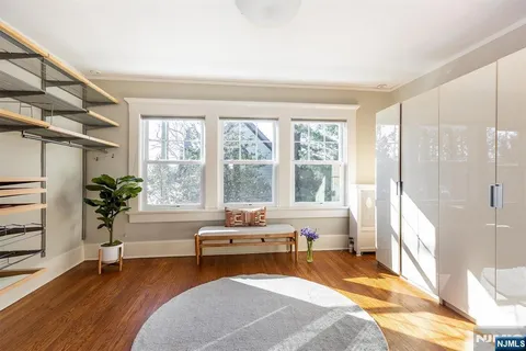 a spacious bedroom with a bed and a couch