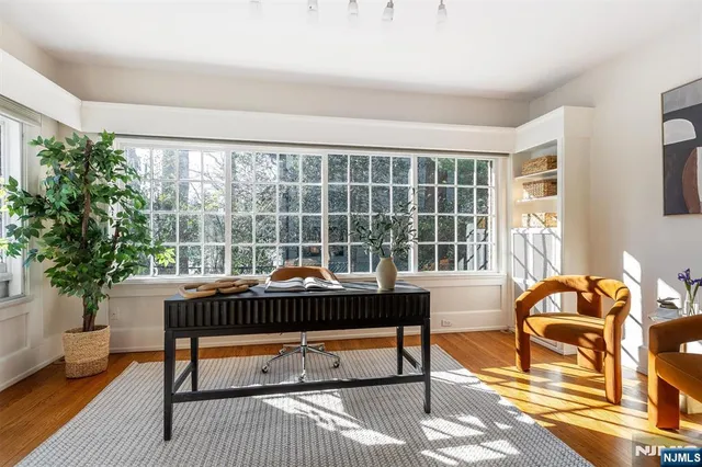 a reading room with furniture and a window
