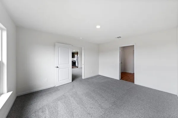 a bathroom with a shower sink and mirror