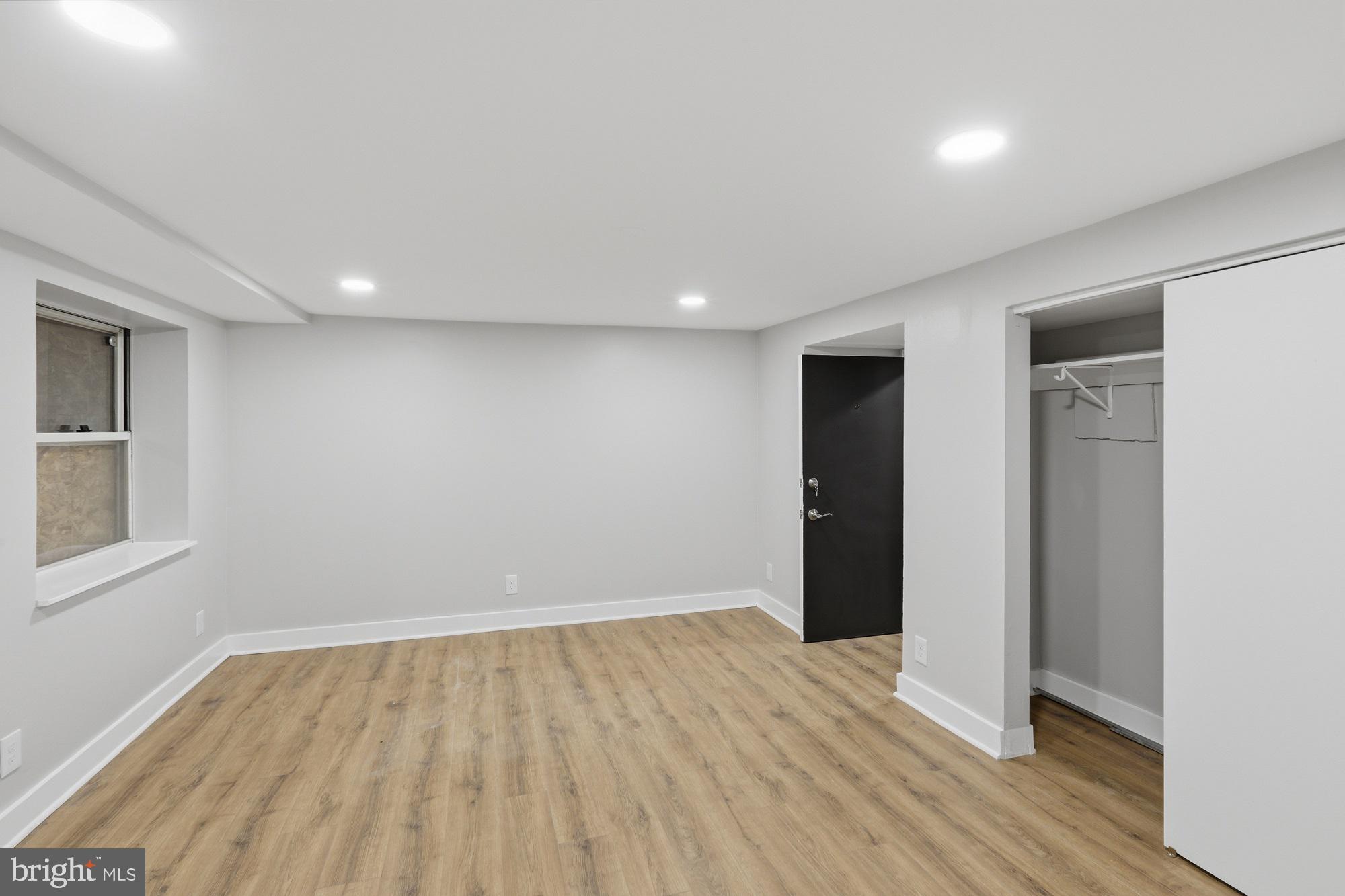 2388 Champlain Street Northwest, Unit 2 Washington, DC 20009 - Photo 13 of 13 a view of an empty room with wooden floor and closet