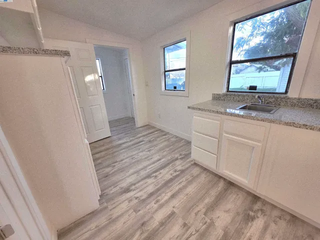 a room with a sink and a mirror