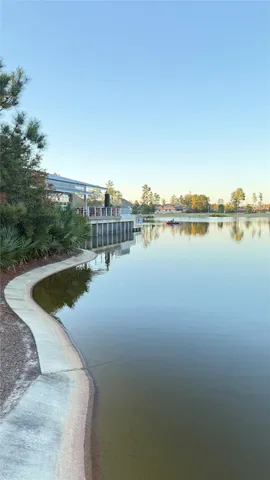 a view of a lake with houses in the back