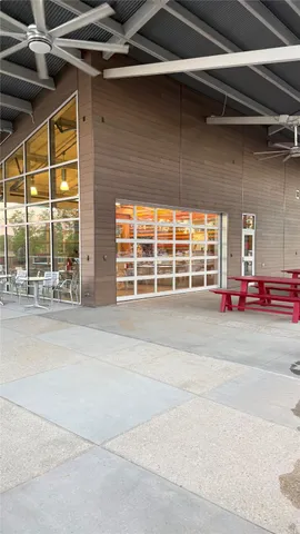 a outdoor view of a building with a garage