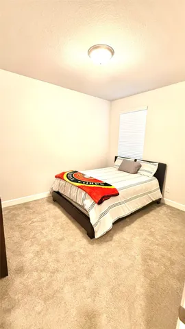 a bedroom with a bed and a cabinets