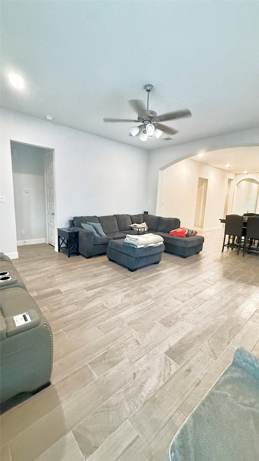 15707 Autumn Sun Court Conroe, TX 77302 - Photo 9 of 13 a living room with furniture and a chandelier