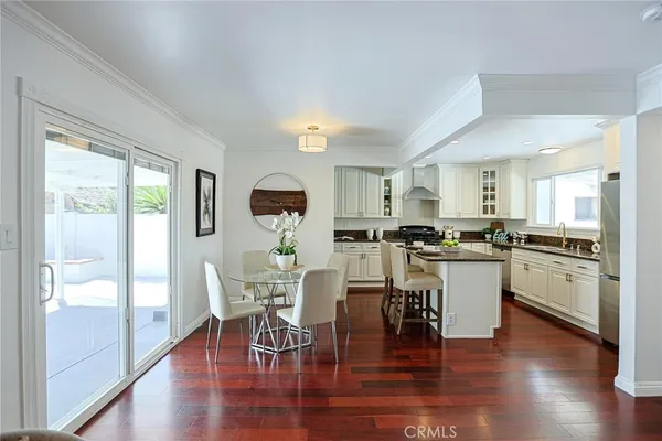 a kitchen with a table and chairs