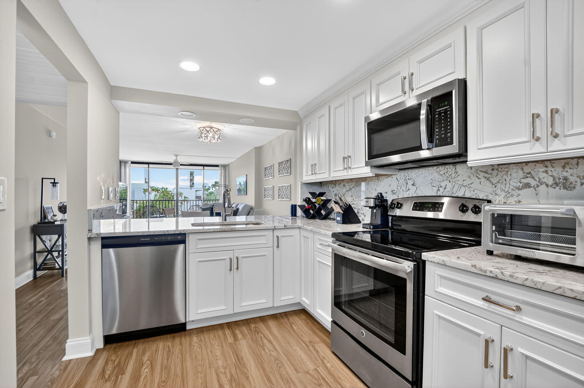 4 Royal Palm Way, Unit 3020 Boca Raton, FL 33432 - Photo 1 of 38 a kitchen with stainless steel appliances granite countertop a stove top oven a sink and white cabinets