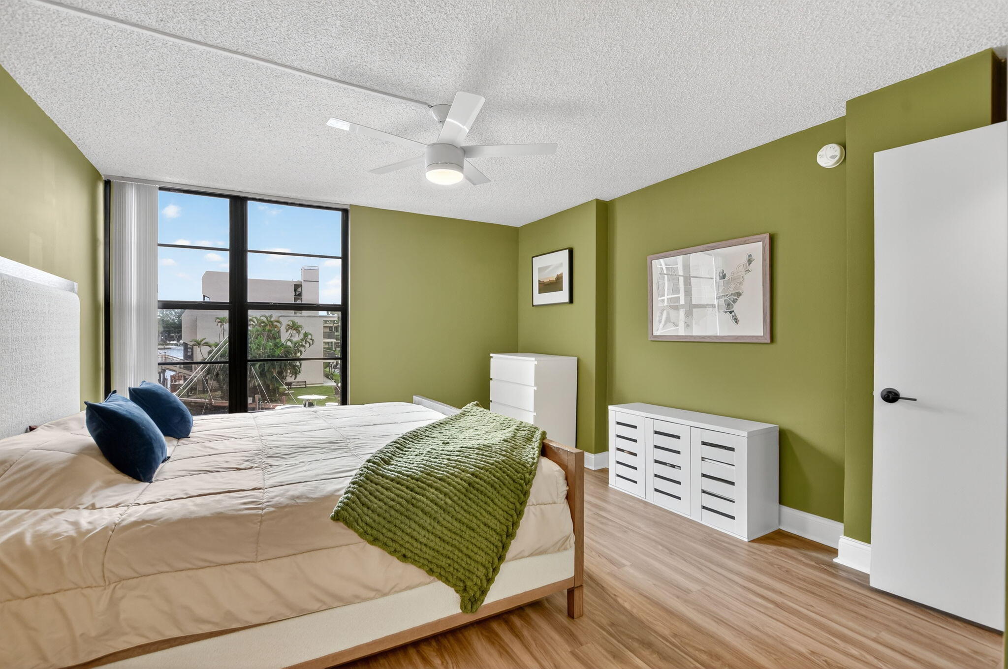 4 Royal Palm Way, Unit 3020 Boca Raton, FL 33432 - Photo 13 of 38 a bedroom with a bed and wooden floor