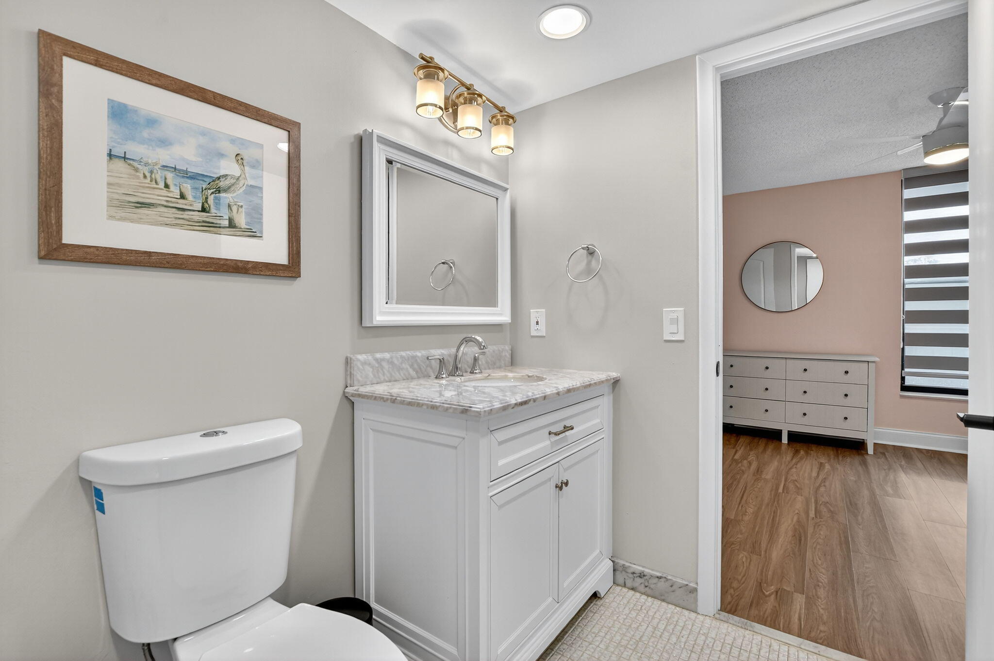 4 Royal Palm Way, Unit 3020 Boca Raton, FL 33432 - Photo 22 of 38 a bathroom with a toilet sink and mirror