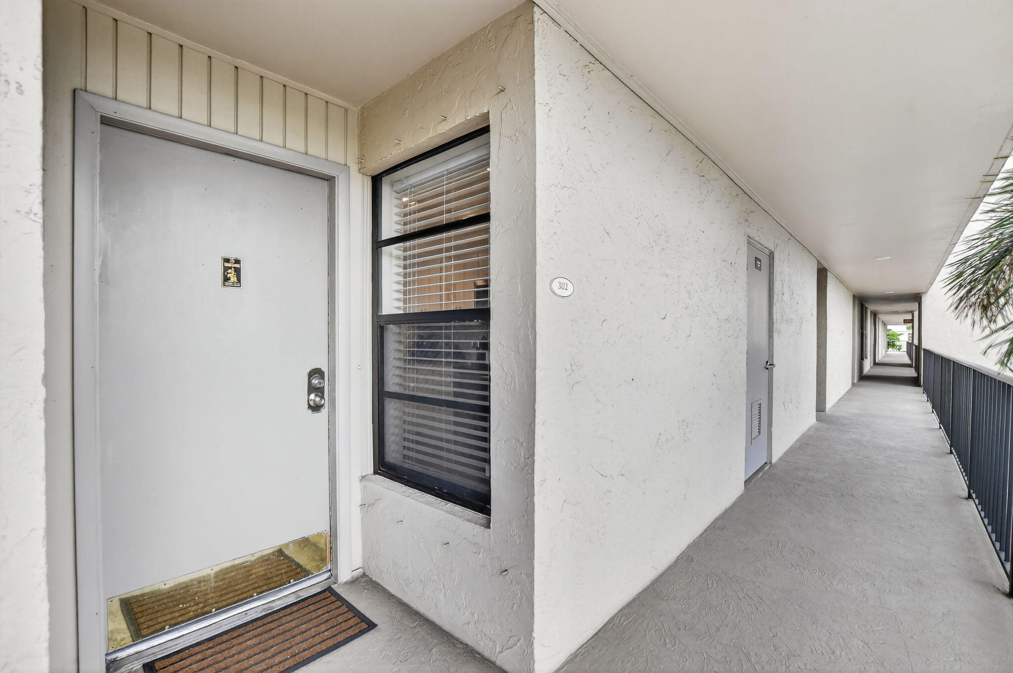 4 Royal Palm Way, Unit 3020 Boca Raton, FL 33432 - Photo 23 of 38 a view of a hallway with wooden floor and staircase