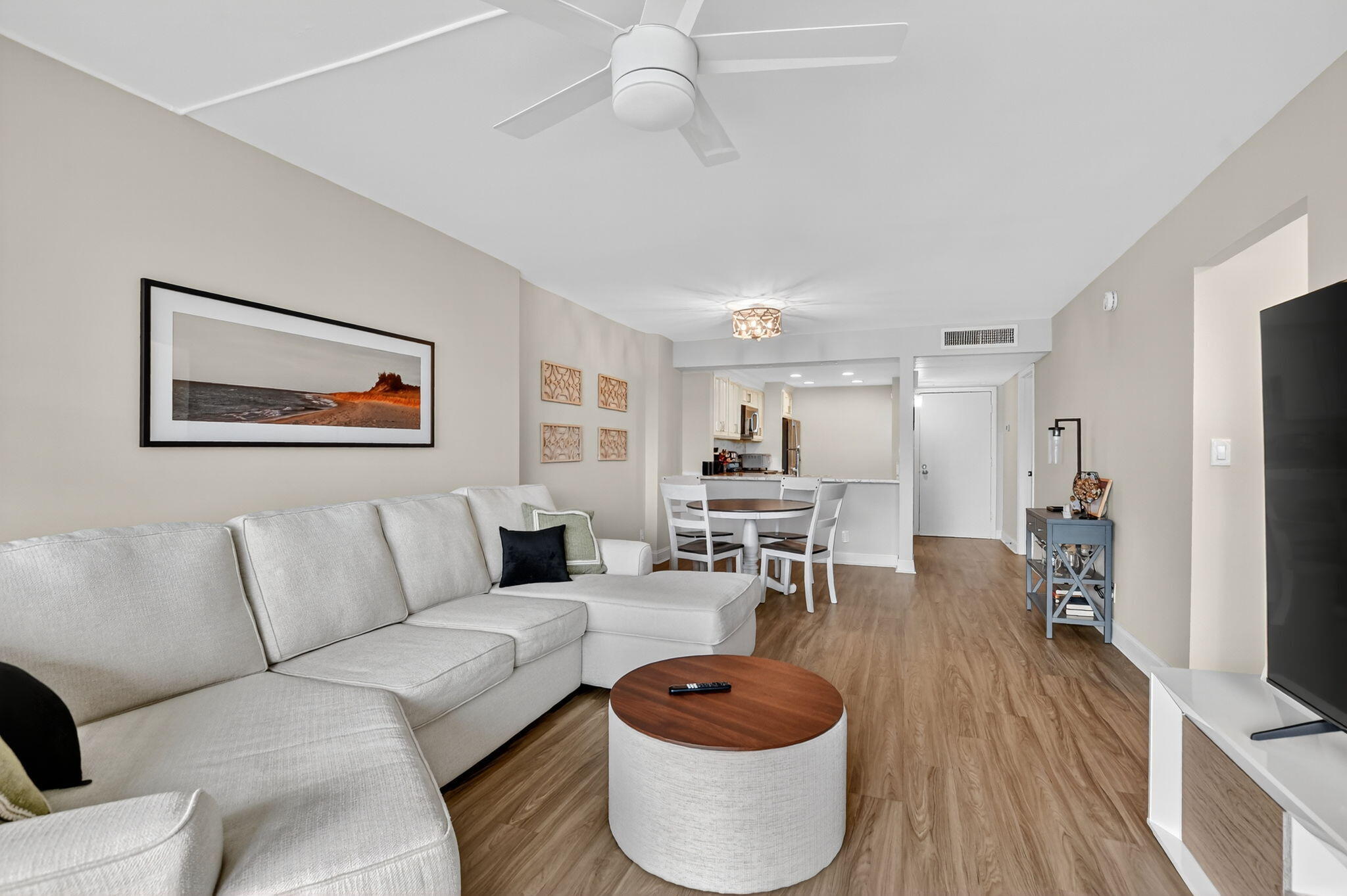 4 Royal Palm Way, Unit 3020 Boca Raton, FL 33432 - Photo 3 of 38 a living room with furniture a wooden floor and a flat screen tv