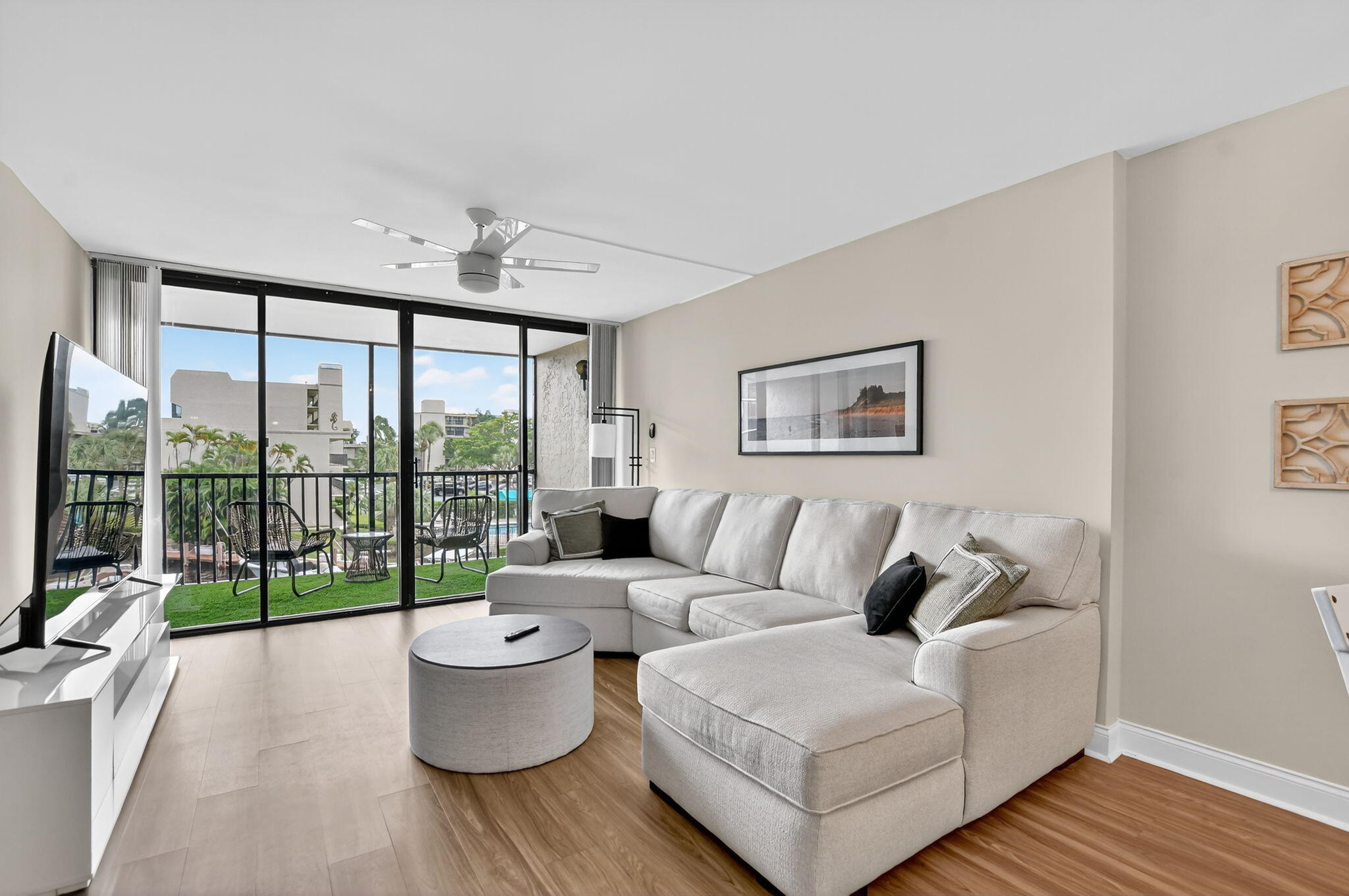 4 Royal Palm Way, Unit 3020 Boca Raton, FL 33432 - Photo 4 of 38 a living room with furniture and a large window