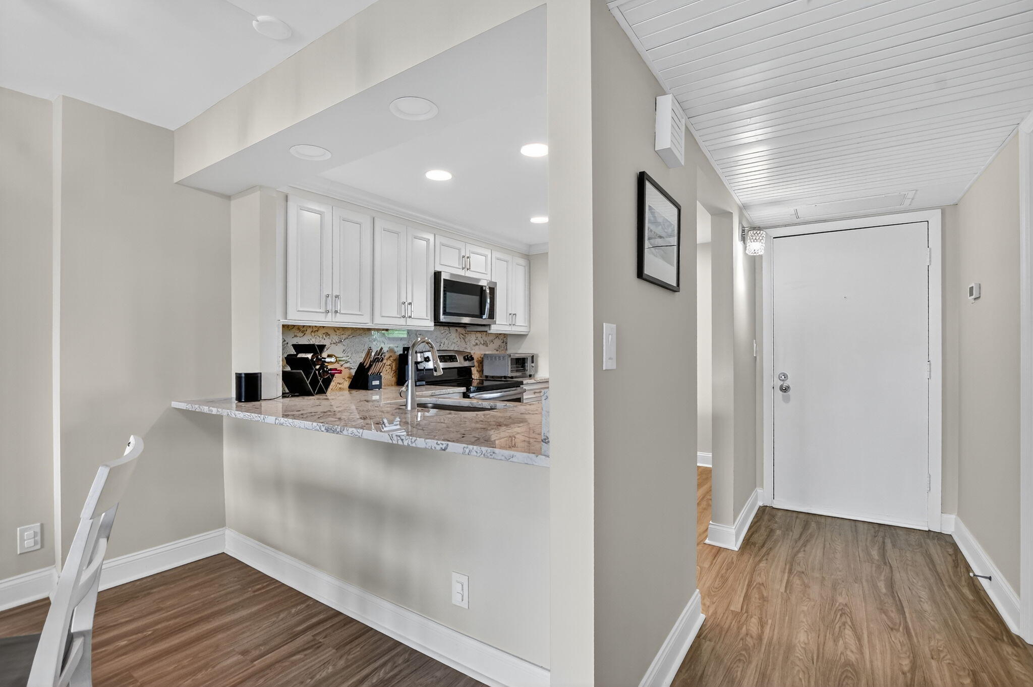 4 Royal Palm Way, Unit 3020 Boca Raton, FL 33432 - Photo 8 of 38 a view of open kitchen with wooden floor and electronic appliances