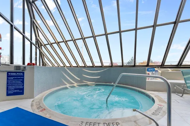 a sitting area with wooden floor