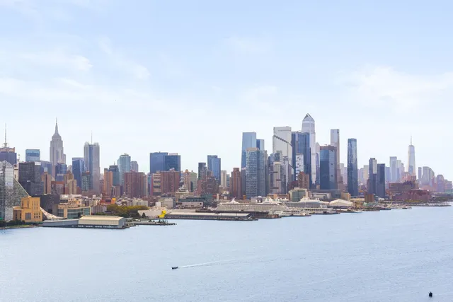 a picture of a room with a bench and a white wall