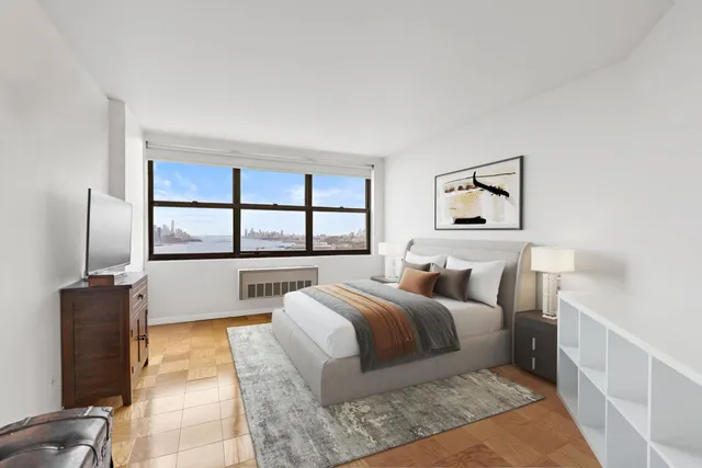 a bedroom with a large bed and a window