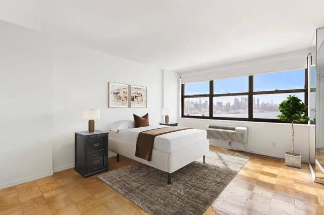 a spacious bedroom with a large bed and a window