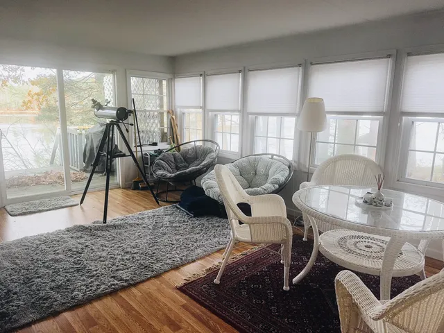 a view of a livingroom with furniture and window