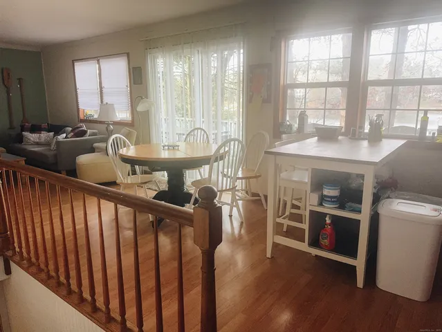 a very nice looking room with many windows and furniture