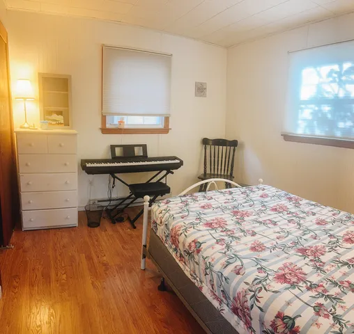 a bedroom with a bed and a table in it