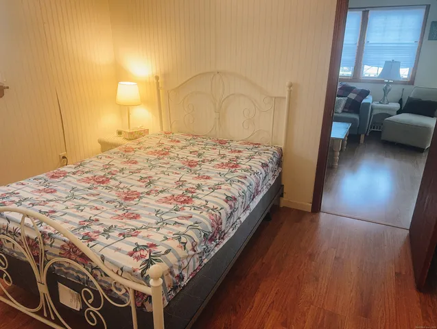 a bedroom with a bed and a view of bathroom