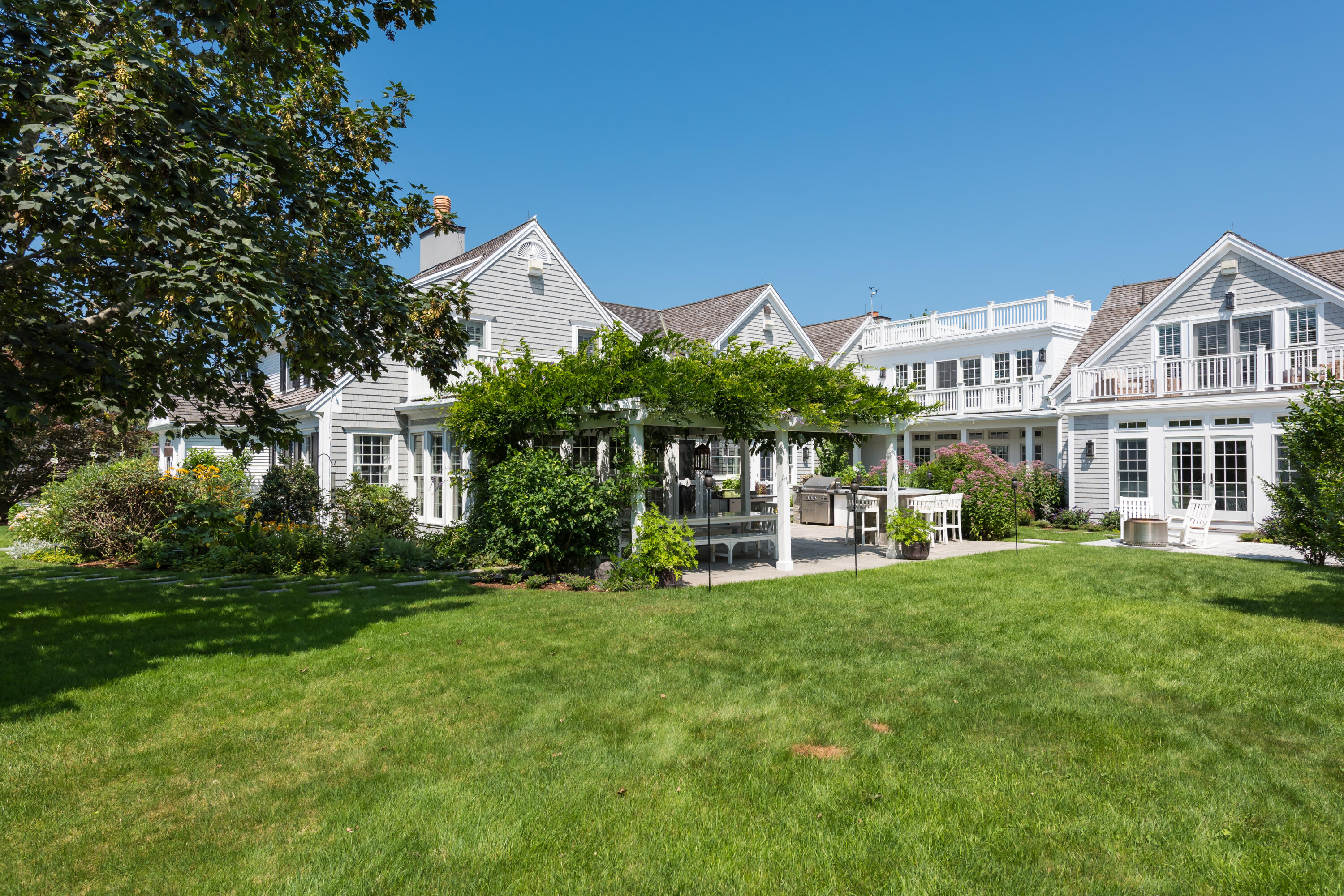 32 Dunes Road Harwich Port, MA 02646 - Photo 18 of 56 a view of a house with a yard and sitting area
