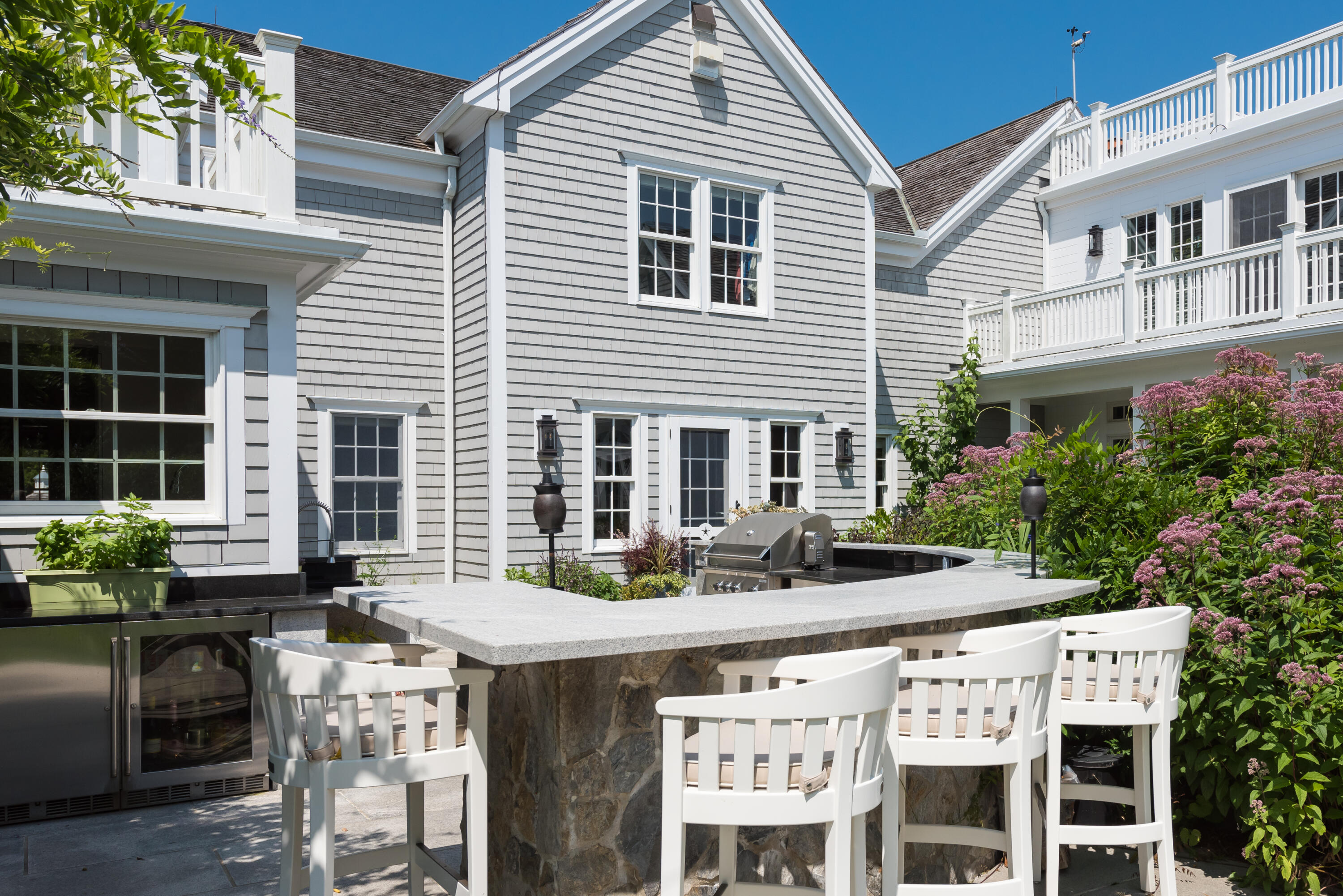 32 Dunes Road Harwich Port, MA 02646 - Photo 20 of 56 a view of a patio with table and chairs and potted plants