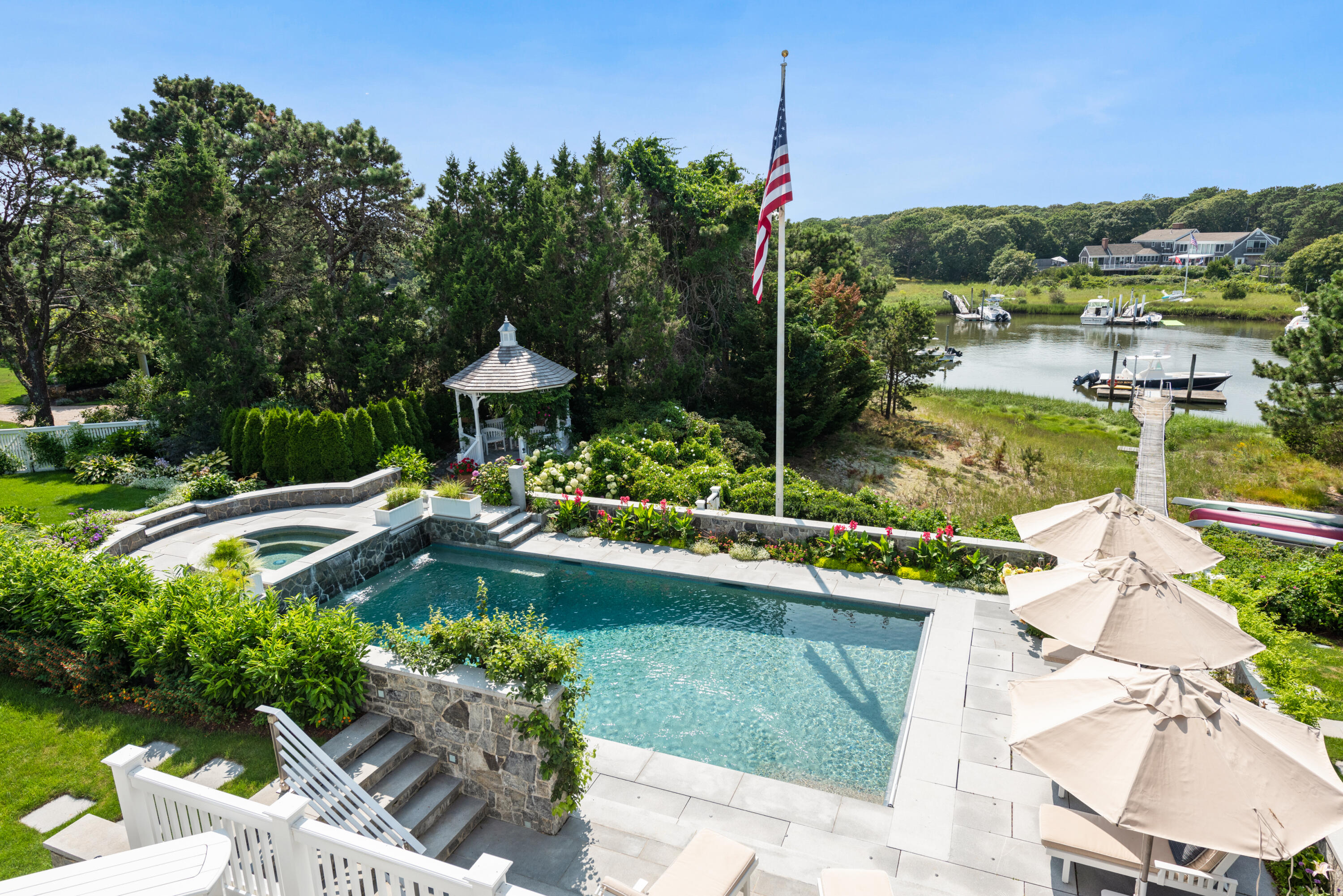 32 Dunes Road Harwich Port, MA 02646 - Photo 29 of 56 a view of a garden and swimming pool