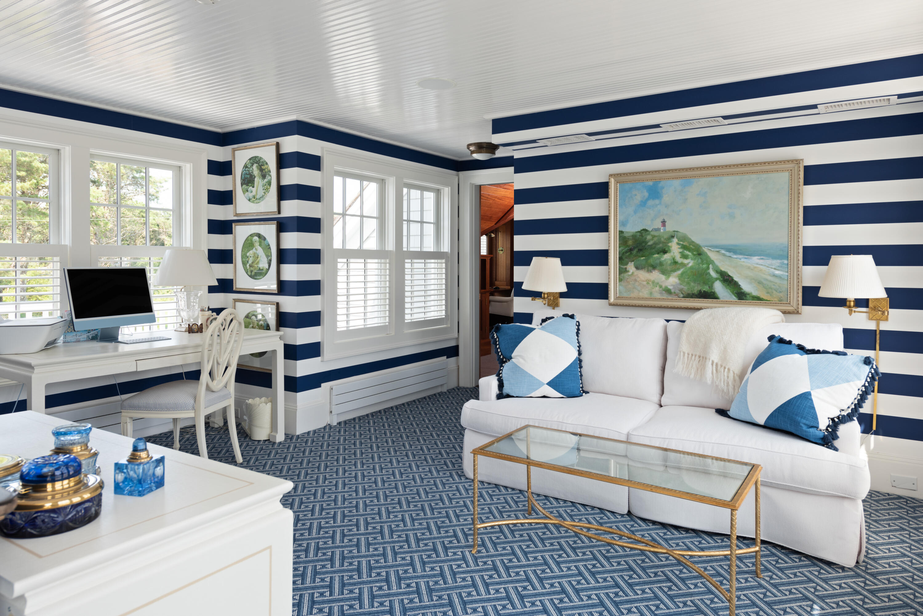 32 Dunes Road Harwich Port, MA 02646 - Photo 32 of 56 a living room with furniture a flat screen tv and a floor to ceiling window