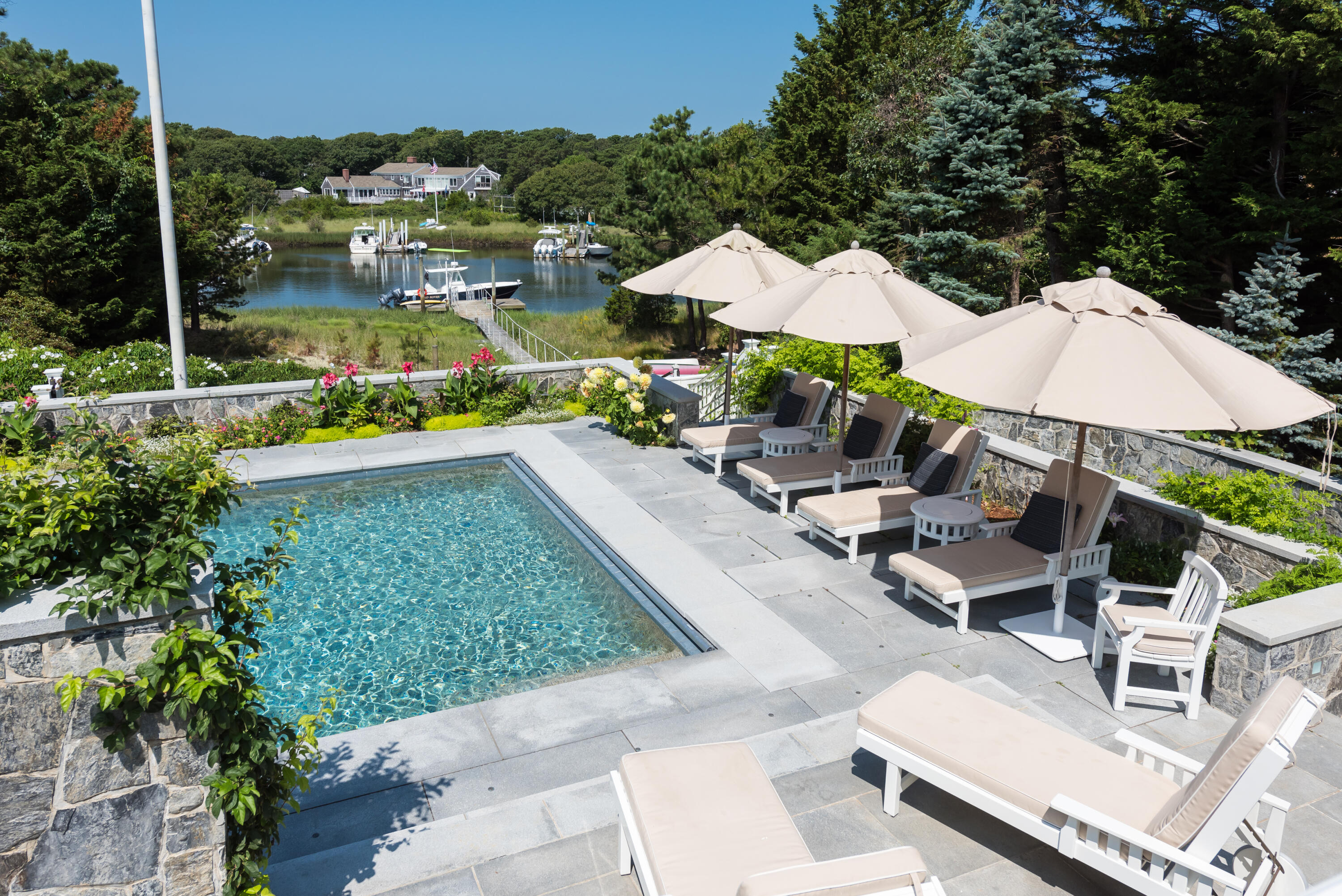 32 Dunes Road Harwich Port, MA 02646 - Photo 7 of 56 a view of backyard with outdoor seating and trees
