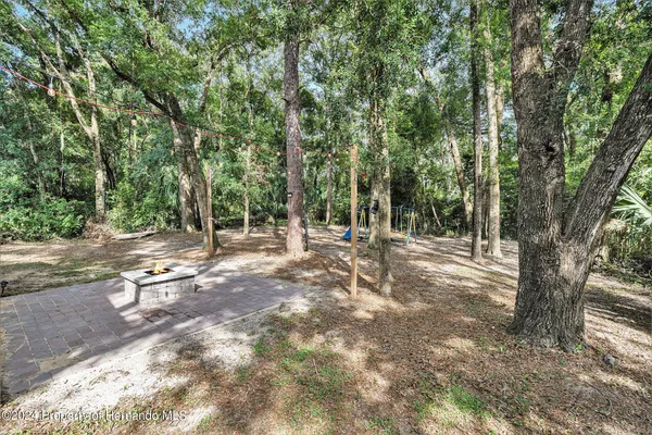 a view of a park with swings and slides