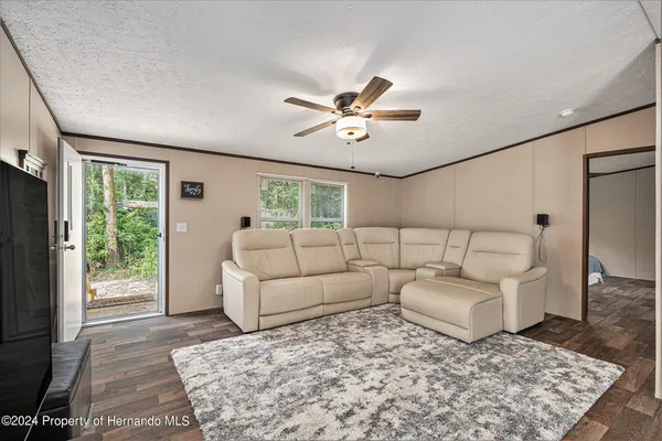 a living room with furniture and a rug