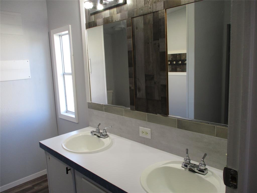 1336 Rains County Road 1530 Point, TX 75472 - Photo 17 of 26 a bathroom with a sink and a mirror