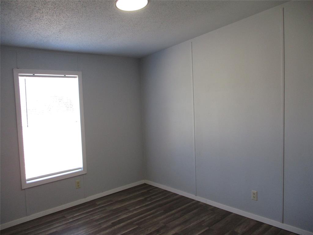 1336 Rains County Road 1530 Point, TX 75472 - Photo 22 of 26 an empty room with wooden floor and windows
