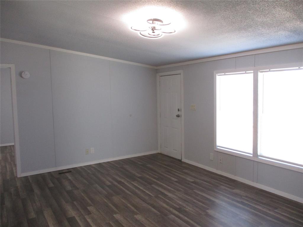 1336 Rains County Road 1530 Point, TX 75472 - Photo 10 of 26 an empty room with wooden floor and windows