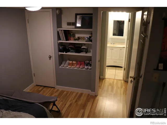 a room with wooden floor and wardrobe