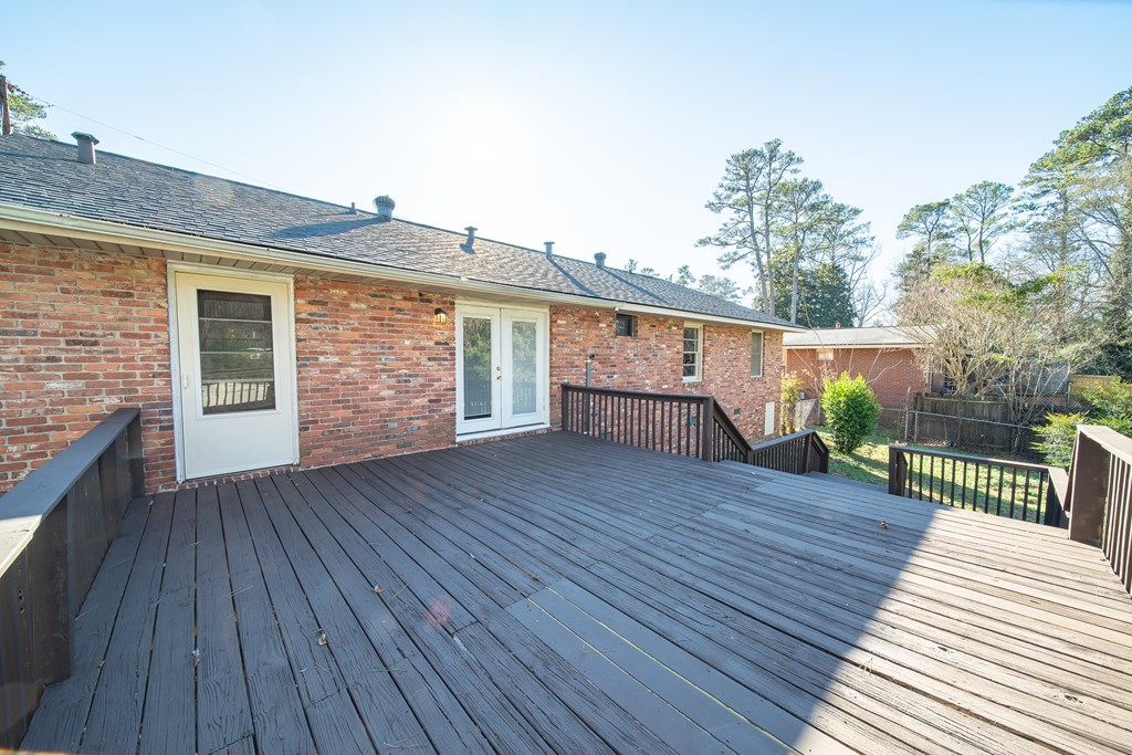 6411 Michael Avenue Columbus, GA 31909 - Photo 12 of 34 a view of house with deck and wooden floor