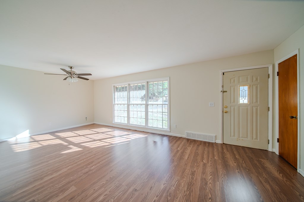 6411 Michael Avenue Columbus, GA 31909 - Photo 15 of 34 wooden floor in an empty room with a window