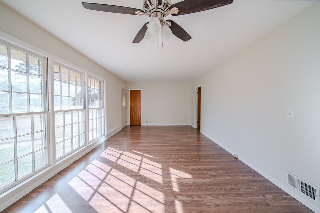 6411 Michael Avenue Columbus, GA 31909 - Photo 17 of 34 a view of an empty room with window and wooden floor