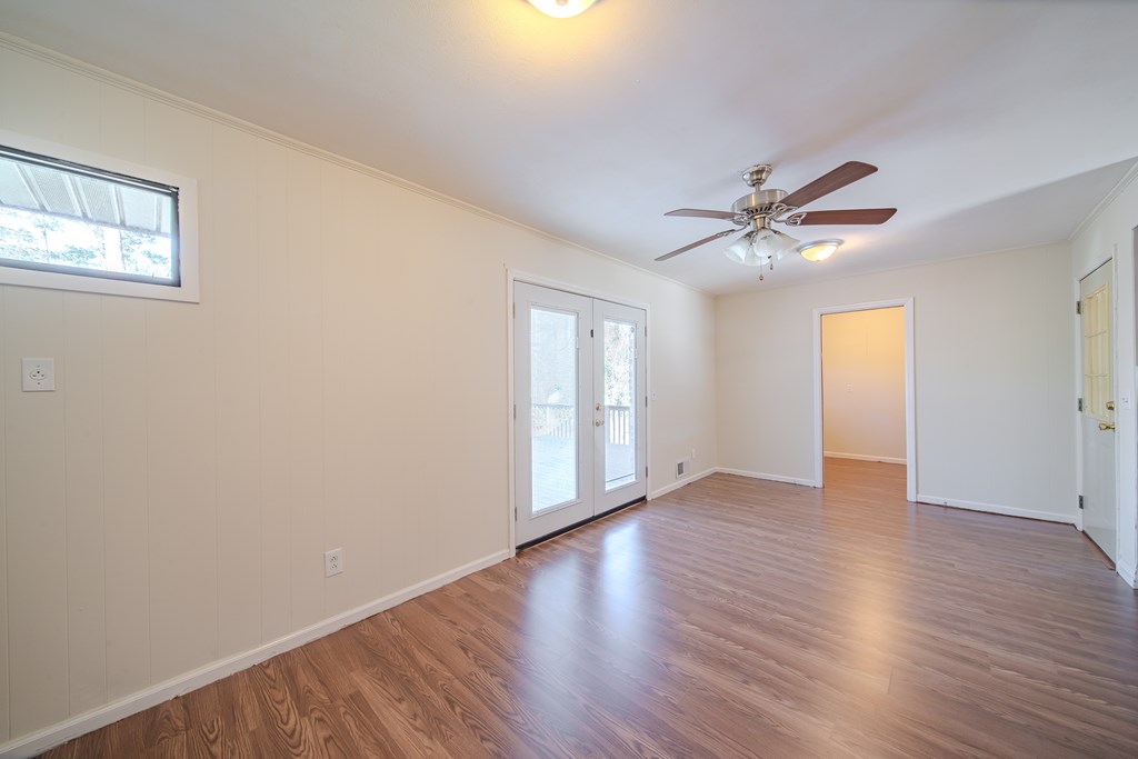 6411 Michael Avenue Columbus, GA 31909 - Photo 19 of 34 a view of an empty room with window and wooden floor